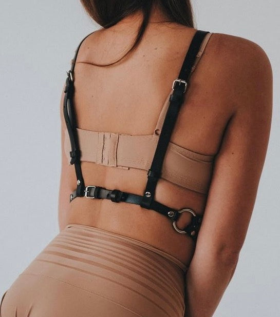 You deserve the finer things in life. Experience the luxury of our finest leather harness. Exquisitely handcrafted with the utmost attention to detail, this stunning piece is perfect for making any woman feel like a goddess. Whether you're looking to add some spice to your bedroom routine or simply want something special to wear for that special someone, our leather harness will make you feel confident and irresistible.